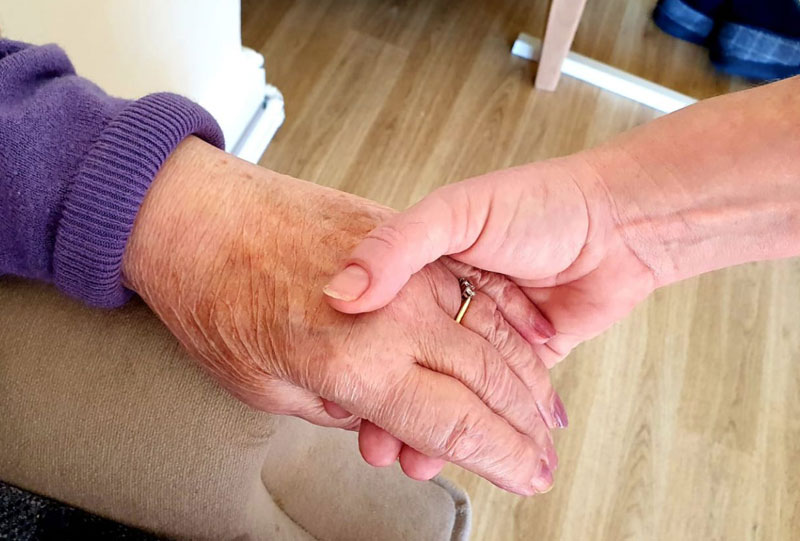 holding hands caring about each other
